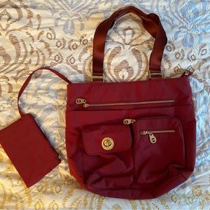 Baggalini tote bag - never used. Like new. Gold fasteners dress it up.